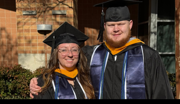 Two students standing next to each other.