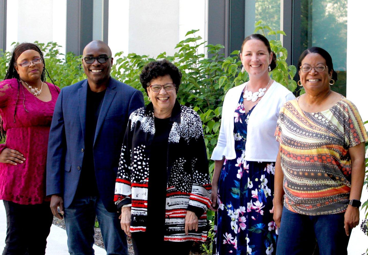 Group photo of diverse faculty